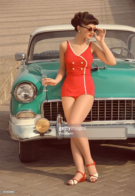 Beautiful Pinup Girl In Front Of The Vintage Car High Res