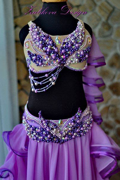 A Purple And Gold Belly Dance Costume On Display