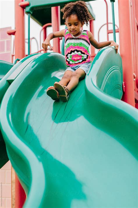 kid sliding   cute  boy sliding   water  stock photo picture