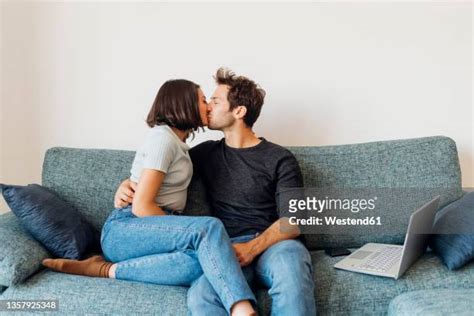 couple making out on couch photos and premium high res pictures getty