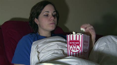 girl watching tv eating popcorn stock video footage 00 15 sbv 300817772
