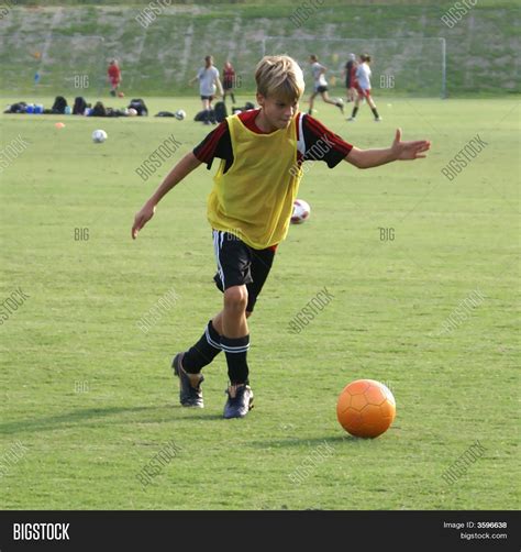 boy kicking soccer image photo  trial bigstock