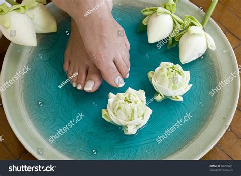feet enjoy  relaxing aromatherapy foot spa  lotus flowers stock
