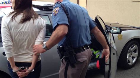 Woman Experiences An Arresting Situation Including Handcuffs Behind