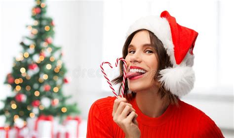 Woman In Santa Hat Licks Candy Canes On Christmas Stock Image Image