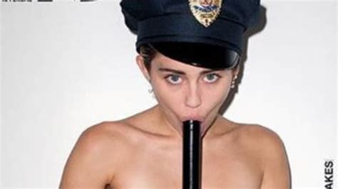 miley cyrus goes topless for candy magazine photos