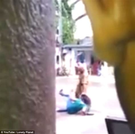 video shows a sri lankan police officer brutally beating a