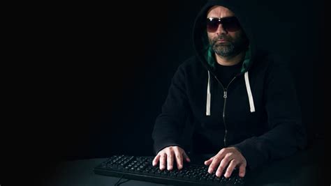 guy  official suit  balaclava typing  keyboard stock footage