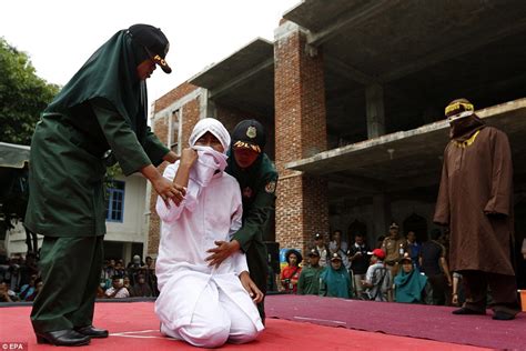 Indonesian Woman Collapses After She Is Publicly Caned For