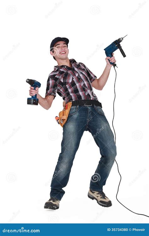 tradesman holding power tools stock photo image