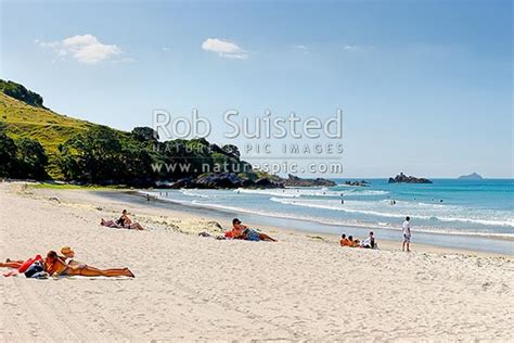 mount maunganui beach  people sunbathing  swimming  distant karewa island