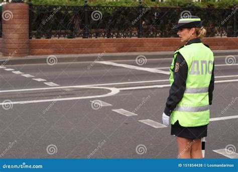 lady police woman traffic control officer working on the road editorial