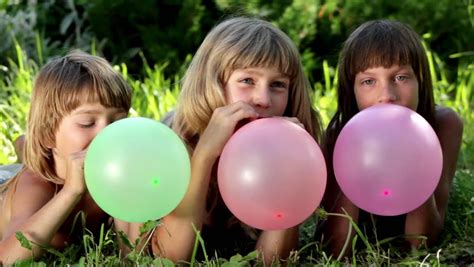 boys blow balloons stock footage video  royalty