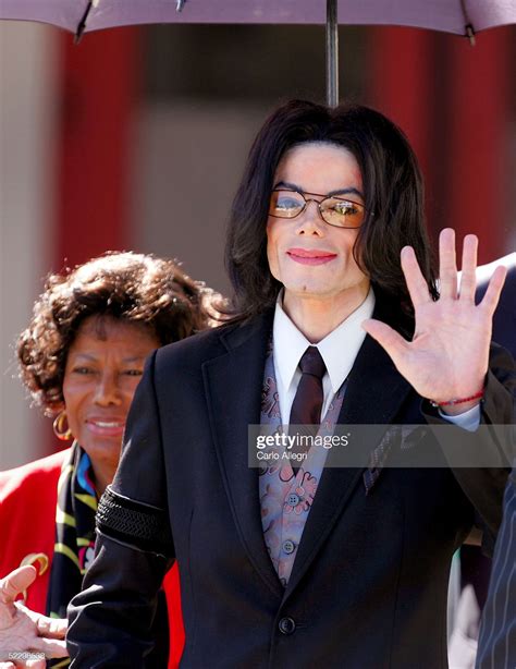 Singer Michael Jackson Waves As He And His Mother Katherine Jackson