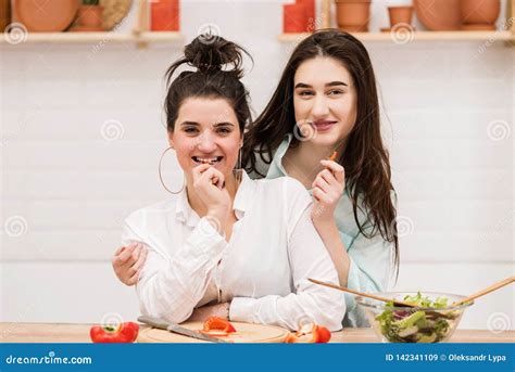 happy lesbian couple preparing food in kitchen stock image image of
