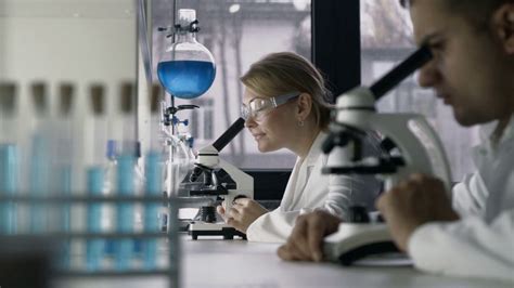 female researcher conducting experiment  stock footage sbv