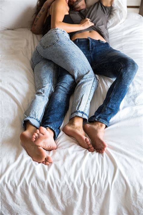 Couple In Bed Wearing Jeans By Stocksy Contributor Jovo Jovanovic