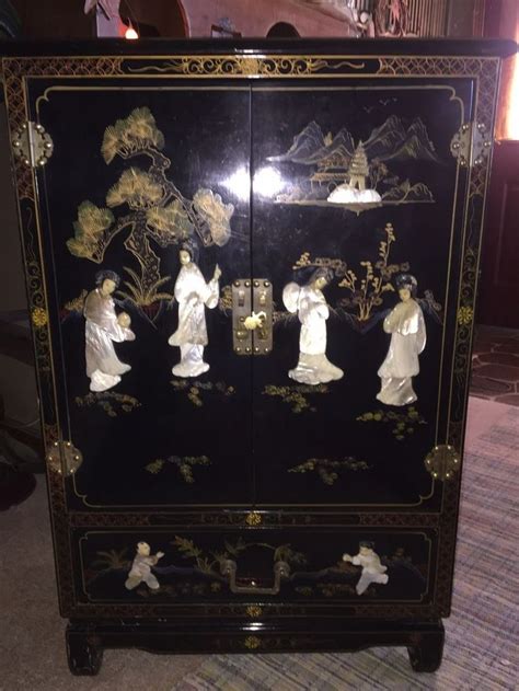 antique oriental black lacquer cabinet with mother of pearl inlay