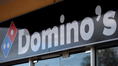 dominos shares fall  price downgrades  west australian