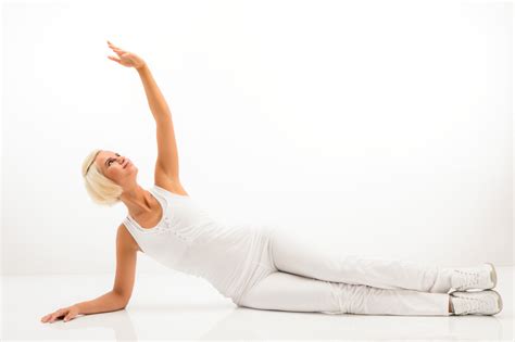 woman stretching her arm fitness yoga exercise workout white background