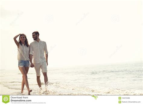 happy fun beach vacations couple walking together laughing having fun