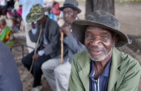men sitting in sharobe village in botswana imb