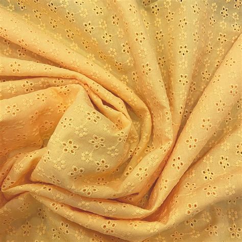 tissu broderie anglaise  coton jaune tissus en ligne