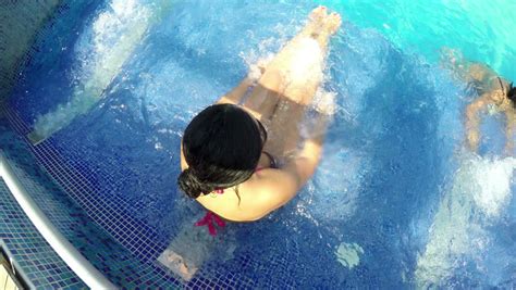 sexy woman enjoy spa thermal pool water jet massage
