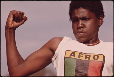 File A Young Black Man Showing His Muscle During A Small Community