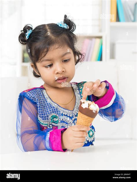 Eating Ice Cream Indian Asian Girl Enjoying An Ice Cream At Home Stock