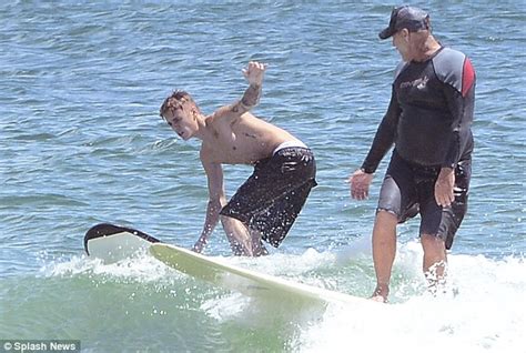 justin bieber fails to make a splash surfing in australia