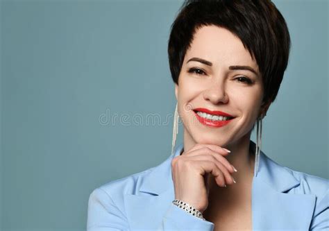 Portrait Of Beautiful Smiling Short Haired Brunette Woman In Blue