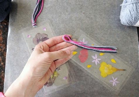 diy pressed flower laminated bookmarks · how to make a