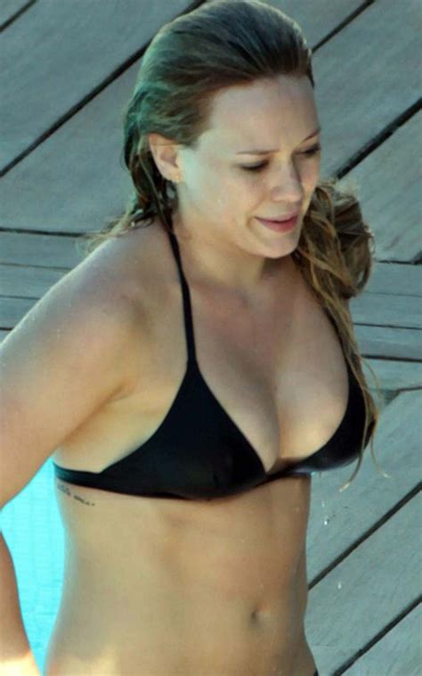 hilary duff posing and showing sexy body and nice tits in sports bra pichunter
