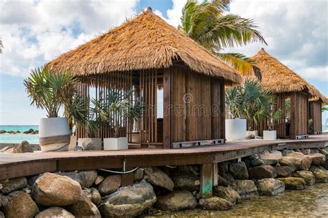spa cabanas huts jetting   wood deck  tropical island resort
