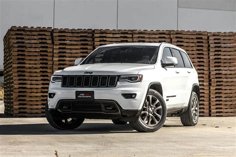 white jeep cherokee suv  stacked brown pallet boards  stock photo