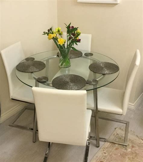 sold  seater  glass dining table   white faux leather