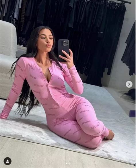 kim kardashian stuns fans with skims pink cleavage baring onesie