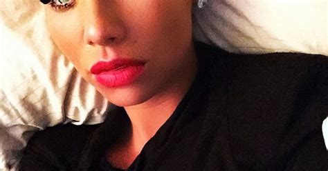 amber rose covers up for a selfie after weeks of flashing her bum and