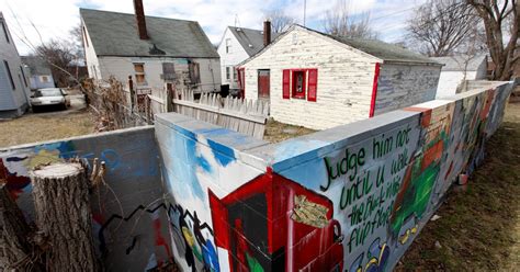 wall that once divided races in detroit remains teaches