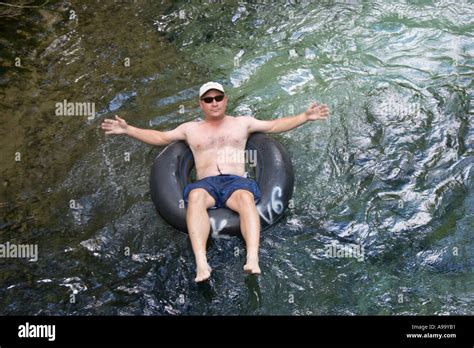 man floating  river   tube  central florida usa stock photo alamy