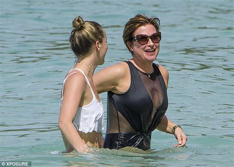 emma forbes dons black swimsuit as she frolics on a barbados beach daily mail online