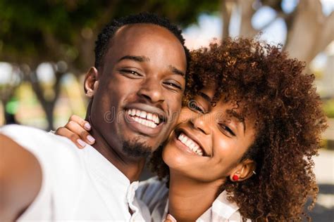 Outdoor Protrait Of African American Couple Taking A Selfie Stock Image