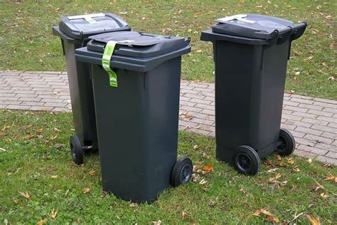black rolling trash bins hallway garbage  dustbin waste