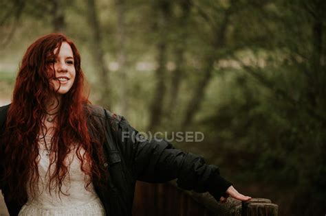 Cheerful Ginger Girl Posing With Outstretched Hands At Forest — Elegant