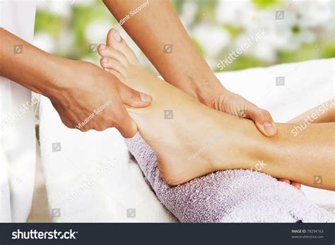 foot massage   spa salon   garden stock photo