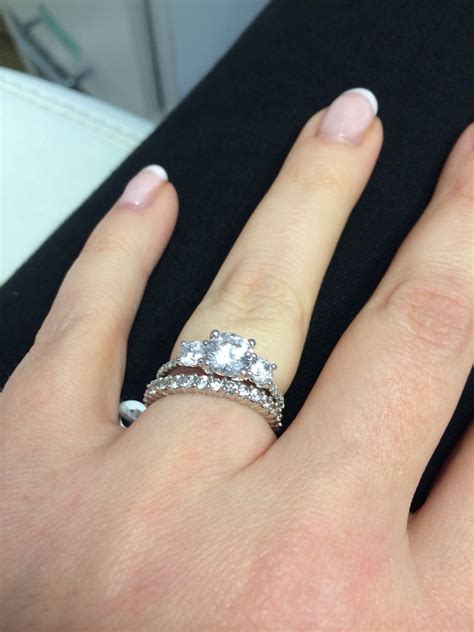 Trilogy ring, with a full diamond-set band White Gold