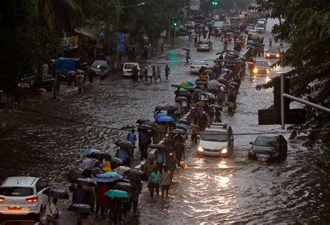 heavy rains batter mumbai disrupt life main runway shut news india times