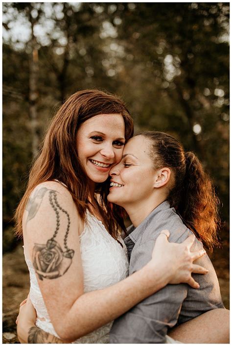 kissing on cliffs and waterfall frolics in this epic engagement shoot lesbian engagement