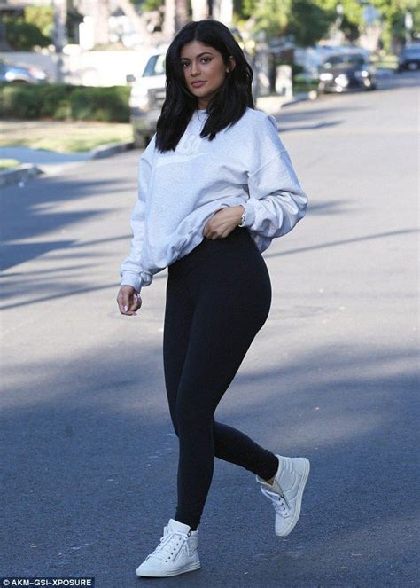 kylie jenner shows off curves in skintight black leggings and sweater